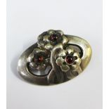 Georg Jensen silver brooch, formed as three flowers with red cabouchon, stamped and number 28,