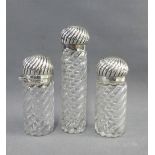 Set of three Victorian silver topped glass bottles, George Betjemann & Sons, London 1888, tallest