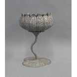 Eastern white metal lotus bowl on a leaf shaped base, 19cm high