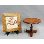 Victorian tile in an oak frame together with a miniature apprentice style table, with a circular