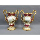 Pair of 19th century Rockingham porcelain urns of lobed baluster form, with entwined vine handles