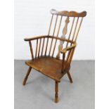 Elm Windsor chair with shaped top rail, solid central splat and combed back, curved arms and solid
