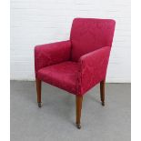 Early 20th century armchair, upholstered with red damask style fabric, on tapering legs