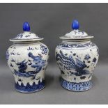 Pair of chinoiserie blue and white jars with covers, 22cm (2)