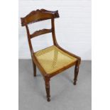 19th century side chair with a carved toprail and horizontal splat, canework seat and fluted legs,