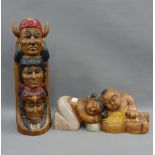 Two painted wooden figure to include a totem pole, longest 42cm (20