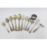 A collection of silver teaspoons, butter knives, salt spoons and a silver napkin ring, with mixed
