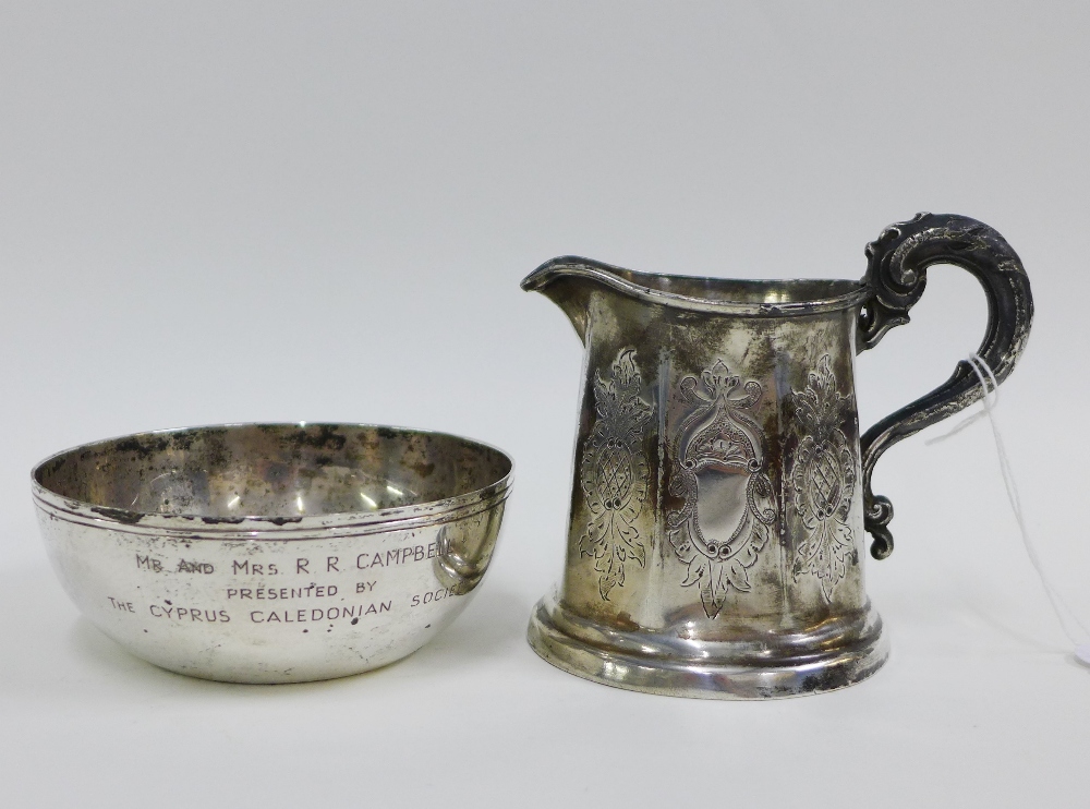 Eastern silver bowl, stamped 800, 11cm wide together with a white metal cream jug, (2)