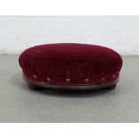 Circular upholstered footstool. 34cm