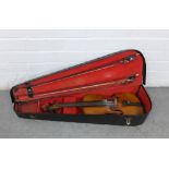 Cased violin with three bows, 60cm