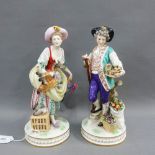 Pair of porcelain male and female figures, the female with a duck and hen and the male with basket