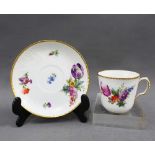 Royal Copenhagen porcelain cup and saucer with handpainted flowers and gilt edged rims, (2)