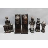 Collection of African hardwood figure s and a pair of bookends, 25cm high (6)