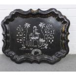A large black papier mache tray with mother of pearl inlaid pattern of building and trees, 68 x 55cm