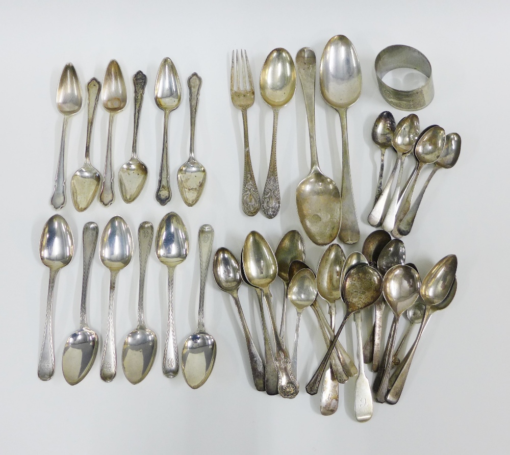 A large collection of silver teaspoons to include various Georgian and Victorian hallmarks, a napkin