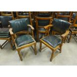 A set of approx thirty early 20th century oak and green leather upholstered chairs, some with woodw