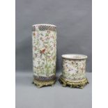 Chinoiserie pottery stick stand with faux gilt base together with an smaller planter of similar