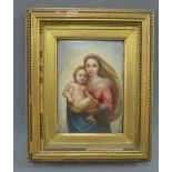 Madonna and Child, a handpainted porcelain plaque in a giltwood frame, size overall 24 x 30cm