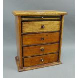 Miniature chest with a pull out slide and four long drawers, 30 x 25cm