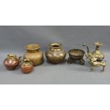 Indian and Eastern metal wares to include a brass scent dispenser, vases and bowls, etc (7)