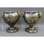 Pair of Japanned metal vases with gilt lion mask head and ring handles, on oval pedestal base,