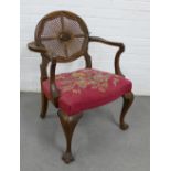 French style mahogany open armchair with an oval Bergere back, upholstered seat and cabriole legs,