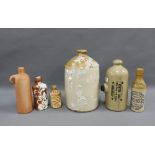 Mixed stoneware flagon and bottles together with a Foot Warmer, tallest 31cm (6)