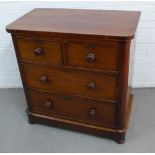 19th century mahogany chest of small proportions, with two short and two long drawers with bun