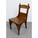 An oak Gothic style hall chair, 92 x 48cm