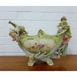 An Austrian bisque porcelain figural table centre piece, (a/f) 45 cm long