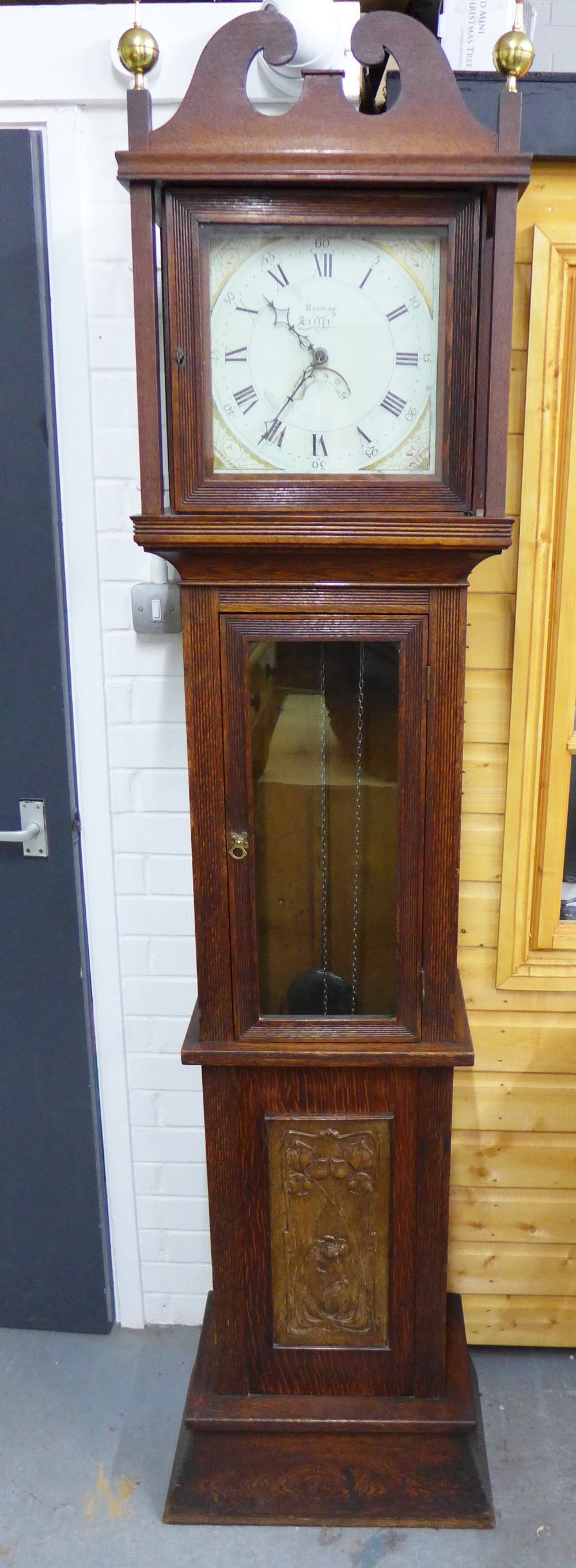 Oak cased Grandfather clock with a painted dial with spider's web spandrels and Roman numerals,