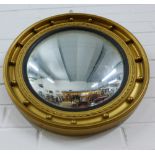 Georgian style convex wall mirror in a circular ebonised and ball mounted gilt frame, 48cm