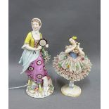 Gold anchor porcelain figure of a girl with a tambourine and lamb and a Dresden ballerina figure,