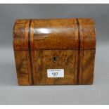 Walnut caddy, the domed top opening to reveal two lead lined divisions, with original covers, 18 x