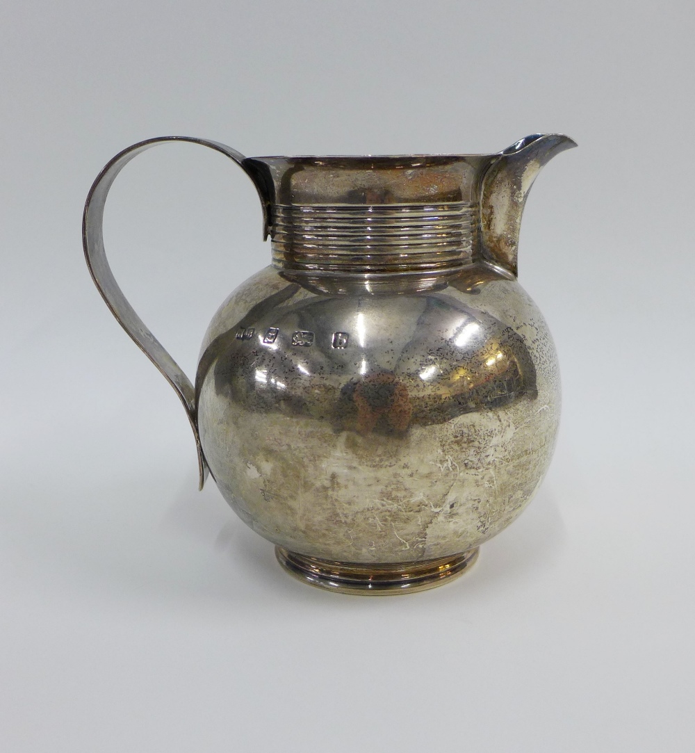 Edwardian silver jug with a reeded strap handle and matching collar, Marston & Bayliss, Birmingham