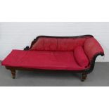 19th century mahogany framed scroll back and arm chaise, with worn red upholstery, on fluted legs