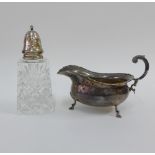 Silver sauce boat, Birmingham 1961, together with a London silver topped glass sugar castor, (2)