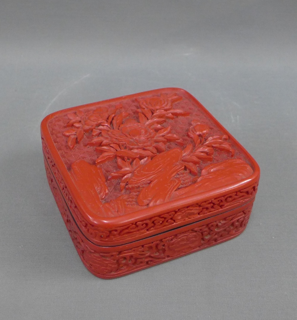 Chinese cinnabar lacquered box and cover, carved with a floral pattern, 13 .5 x 13.5cm