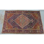 North West Persian rug with an allover foliate field and flowerhead borders, 205 x 127cm