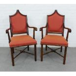 Pair of open armchairs with pointed top rail, red upholstered backs and seats and faux bamboo