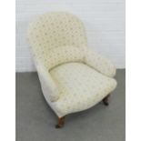 Upholstered armchair with mahognay legs and ceramic castors, 58 x 80 x 65cm