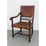 Late 19th / early 20th century open armchair with worn leather woven back and seat, 57 x 98 x 57cm