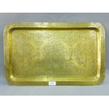 Eastern brass tray of rectangular form, with engraved foliate and calligraphy pattern, 54 x 34cm
