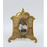 A Moorish style gilt brass photograph frame, retailed by Carlisle & Watts, Edinburgh 22 x 18cm