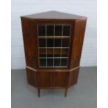 Retro faux rosewood veneered corner cabinet, the glazed door with taped gilt design, 140 x 60cm