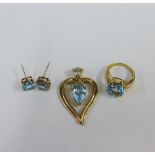 9ct gold cocktail ring claw set with a circular topaz, 9ct gold heart shaped pendant with a peart