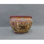 Terracotta jardiniere planter with chinoiserie motifs and handles to side, on three stile feet, 34cm