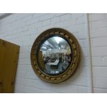 Georgian style circular gilt convex mirror with ebonised slip, 50cm diameter