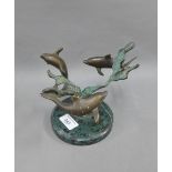 Bronze dolphin group, on a circular hardstone base, 15cm