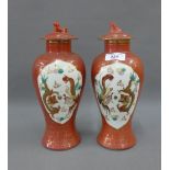 Pair of Chinese porcelain baluster vases with covers, 26cm (2)